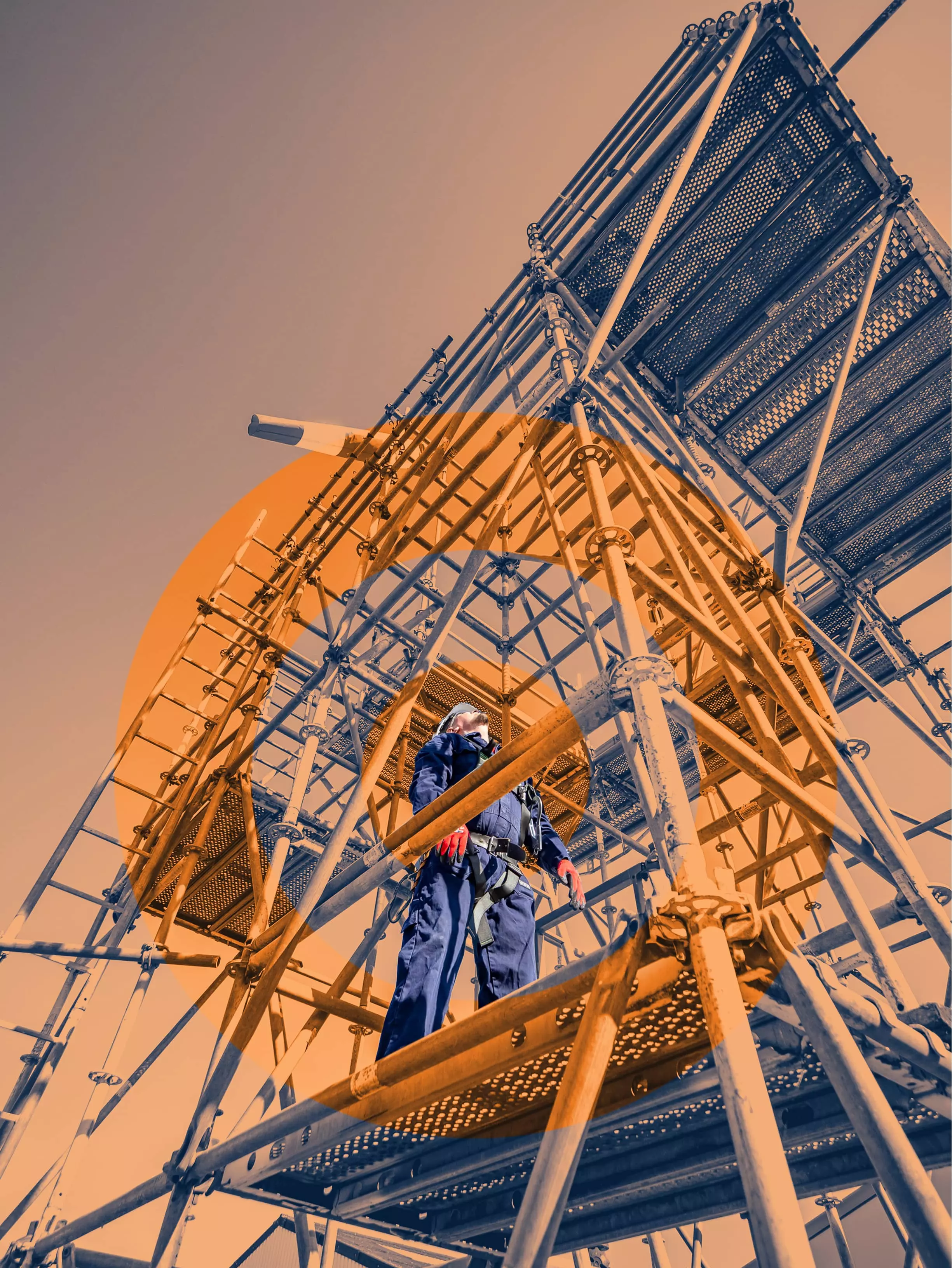 Scaffolder in full safety gear standing on scaffolding, inspecting or communicating during a high-access job.