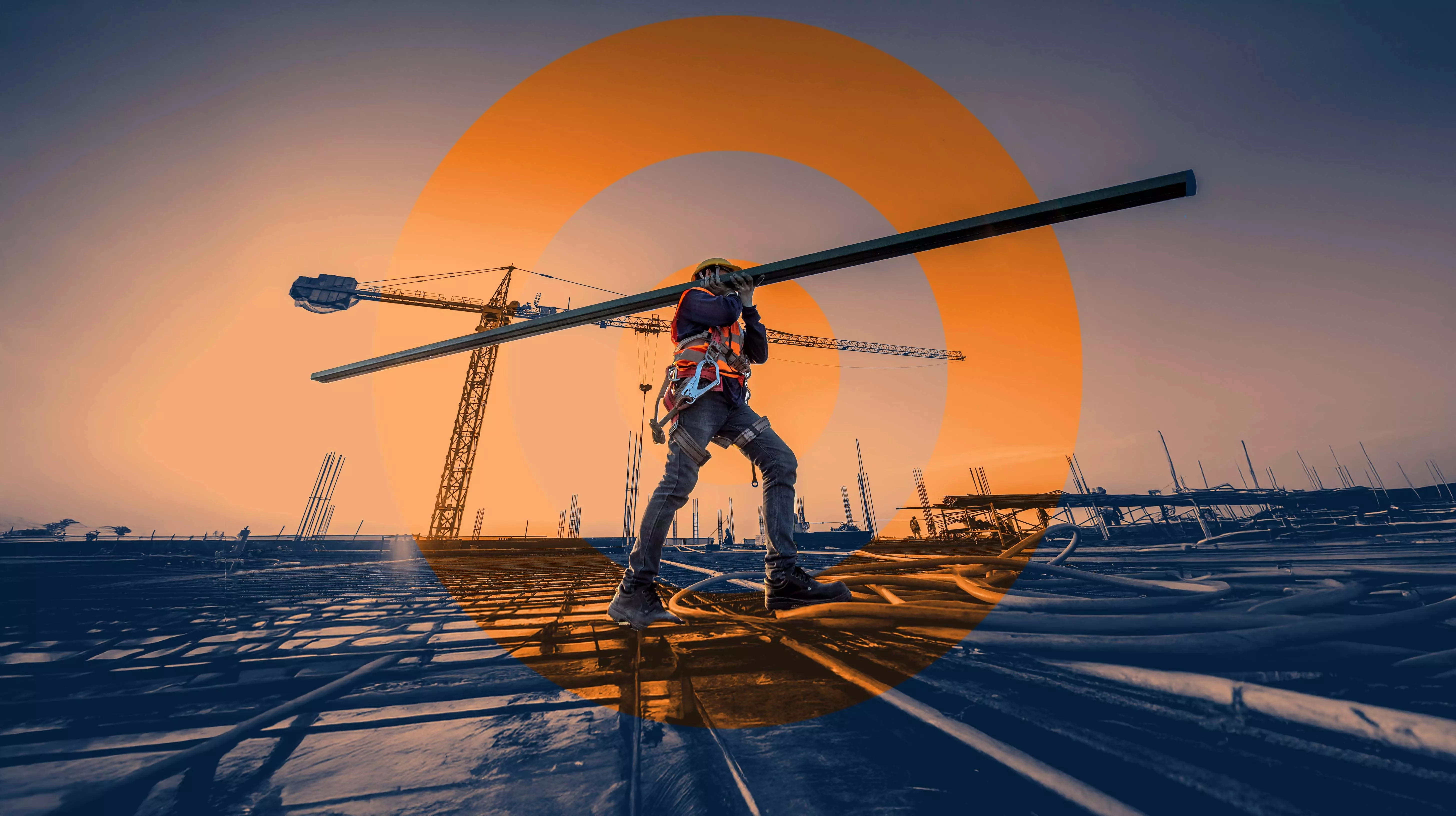 Building the Future: Strength in Every Step Construction worker carrying a metal beam across a building site with cranes and big ORANJEGROEP logo in the background, symbolizing strength and progress.
