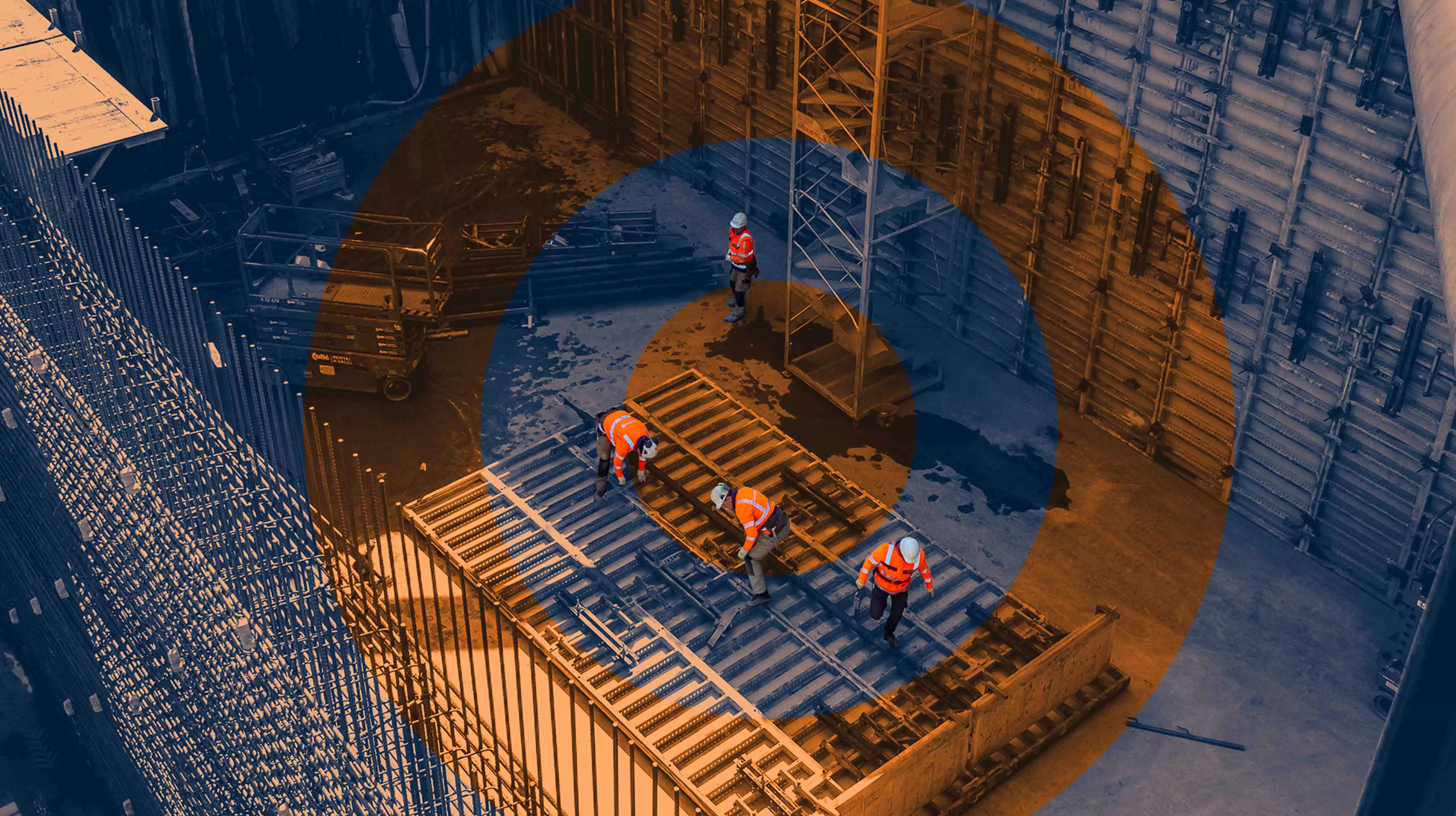 Teamwork in Action: Heavy Construction Below Ground
Overhead view of construction workers assembling a large structural frame inside a deep excavation site.